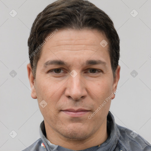 Joyful white adult male with short  brown hair and brown eyes