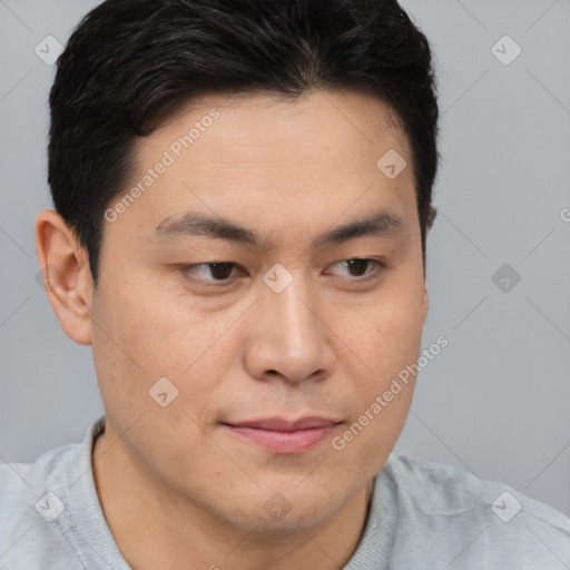 Joyful asian young-adult male with short  brown hair and brown eyes