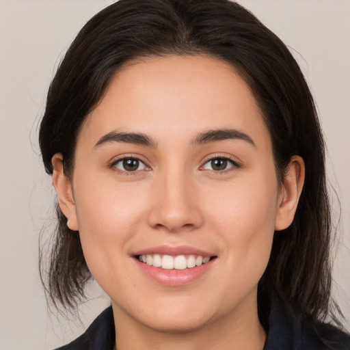 Joyful white young-adult female with medium  brown hair and brown eyes