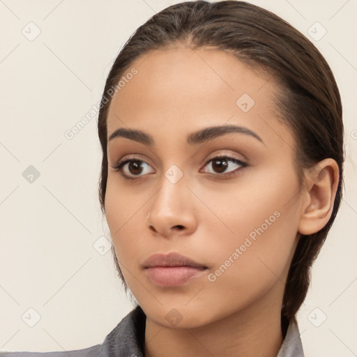 Neutral white young-adult female with long  brown hair and brown eyes