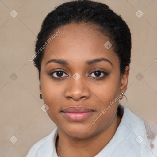 Joyful black young-adult female with short  black hair and brown eyes