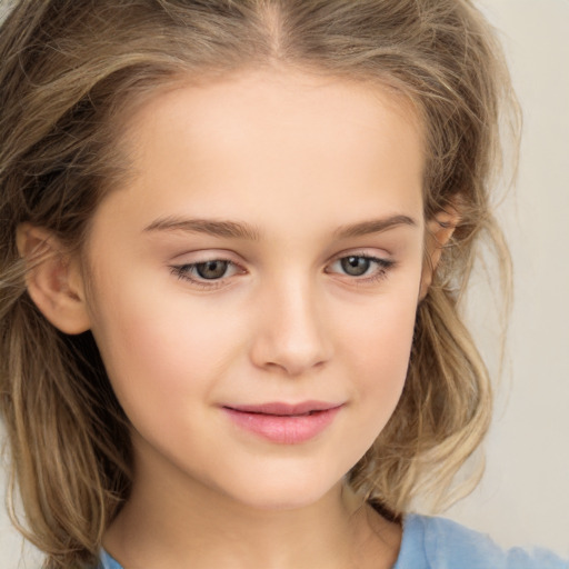 Joyful white child female with long  brown hair and brown eyes