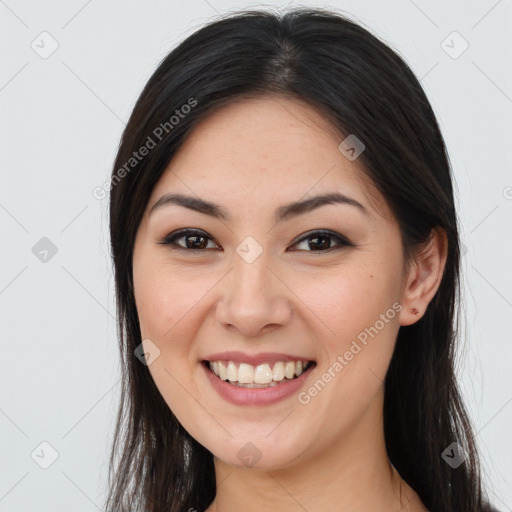 Joyful asian young-adult female with long  brown hair and brown eyes