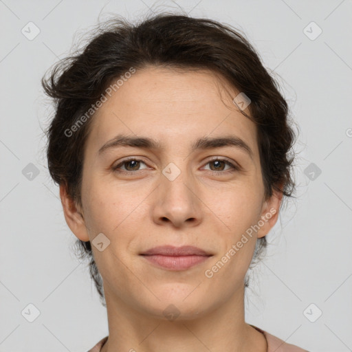 Joyful white adult female with short  brown hair and brown eyes