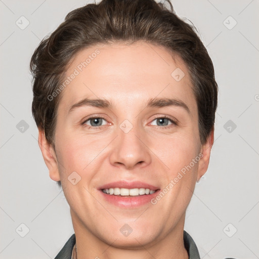 Joyful white young-adult female with short  brown hair and grey eyes