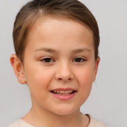 Joyful white child female with short  brown hair and brown eyes