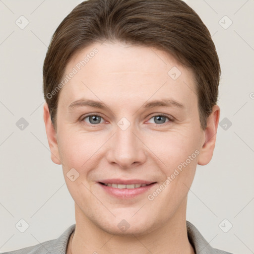 Joyful white young-adult female with short  brown hair and grey eyes