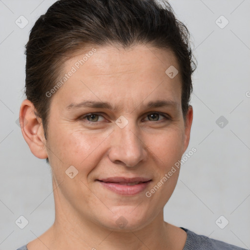 Joyful white adult female with short  brown hair and brown eyes