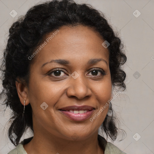 Joyful black adult female with medium  brown hair and brown eyes