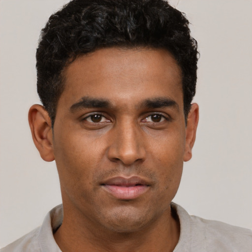 Neutral latino young-adult male with short  brown hair and brown eyes