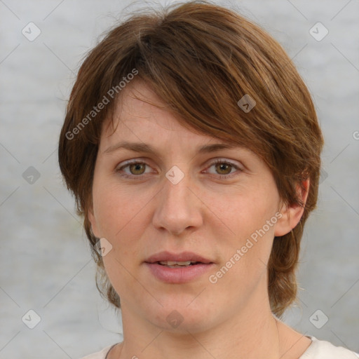 Joyful white adult female with medium  brown hair and grey eyes