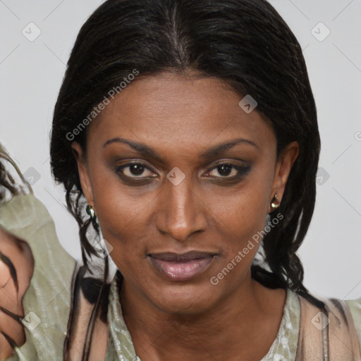 Joyful black adult female with medium  brown hair and brown eyes