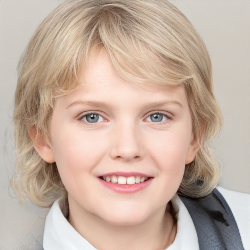 Joyful white child female with medium  blond hair and blue eyes