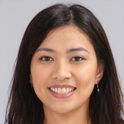 Joyful white young-adult female with long  brown hair and brown eyes