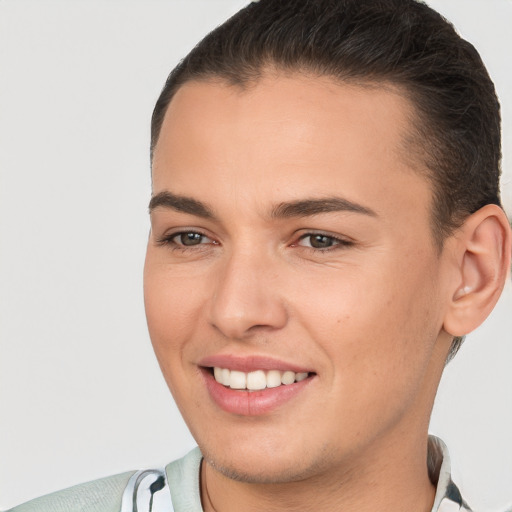 Joyful white young-adult female with short  brown hair and brown eyes