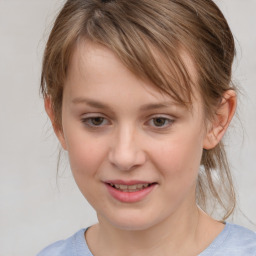 Joyful white child female with medium  brown hair and brown eyes