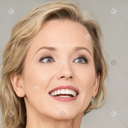 Joyful white young-adult female with medium  brown hair and blue eyes