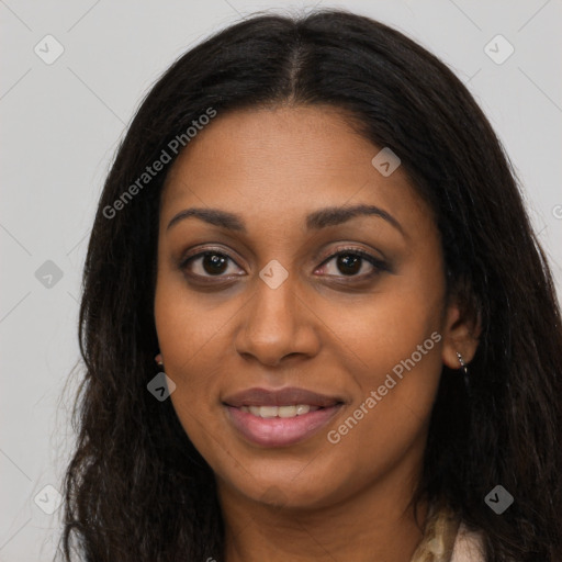 Joyful black young-adult female with long  brown hair and brown eyes