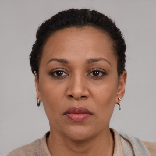 Neutral black adult female with short  brown hair and brown eyes