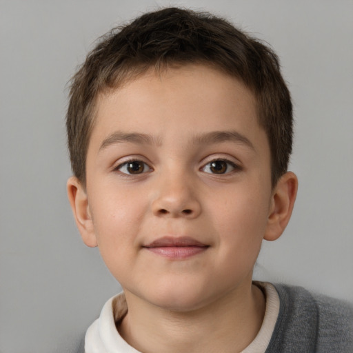 Joyful white child male with short  brown hair and brown eyes