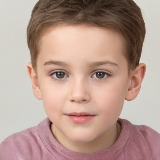 Joyful white child male with short  brown hair and brown eyes