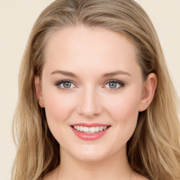 Joyful white young-adult female with long  brown hair and blue eyes