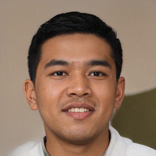 Joyful asian young-adult male with short  black hair and brown eyes