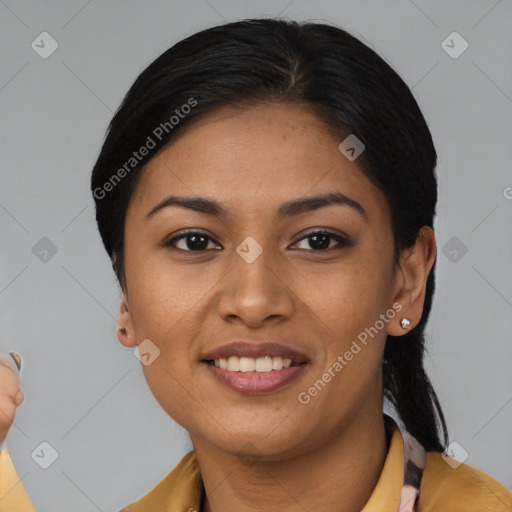 Joyful latino young-adult female with short  black hair and brown eyes