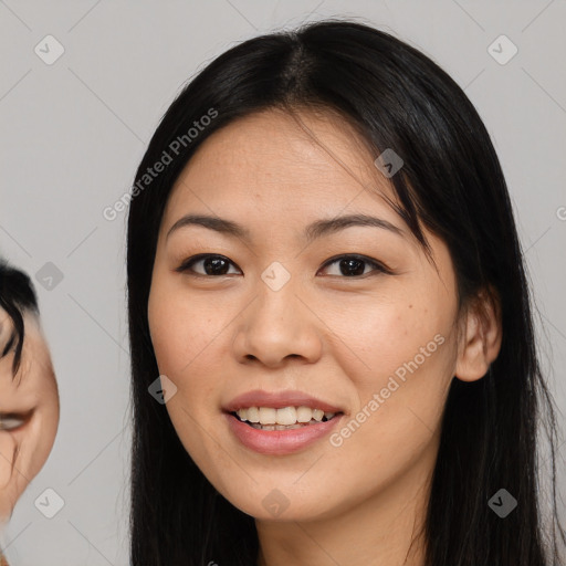 Joyful asian young-adult female with long  black hair and brown eyes