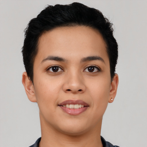 Joyful latino young-adult female with short  black hair and brown eyes