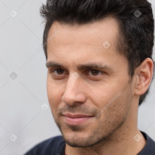 Joyful white adult male with short  brown hair and brown eyes