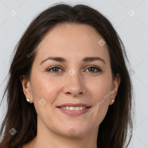 Joyful white young-adult female with long  brown hair and brown eyes