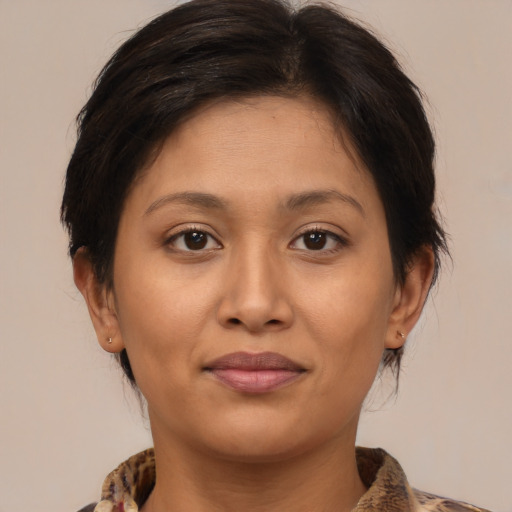 Joyful white young-adult female with medium  brown hair and brown eyes