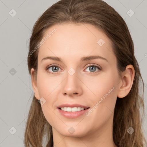 Joyful white young-adult female with long  brown hair and grey eyes