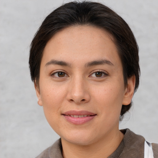 Joyful white young-adult female with medium  brown hair and brown eyes