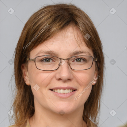 Joyful white adult female with medium  brown hair and blue eyes