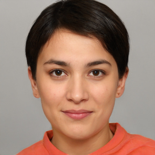 Joyful white young-adult female with short  brown hair and brown eyes