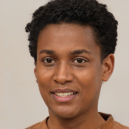 Joyful black young-adult male with short  brown hair and brown eyes