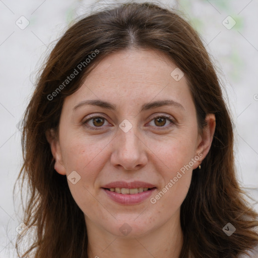 Joyful white adult female with long  brown hair and brown eyes