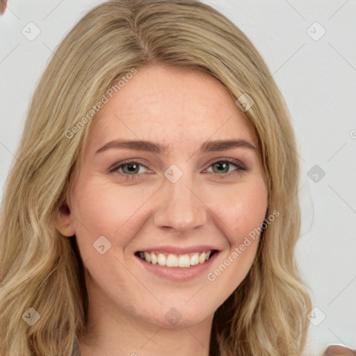 Joyful white young-adult female with long  brown hair and green eyes