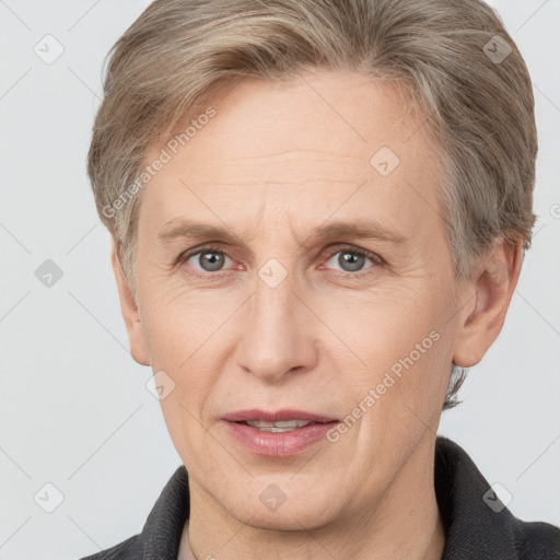 Joyful white adult male with short  brown hair and grey eyes