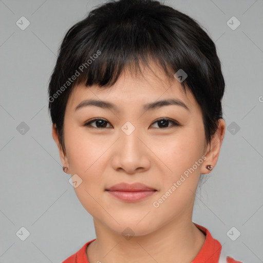 Joyful asian young-adult female with short  brown hair and brown eyes