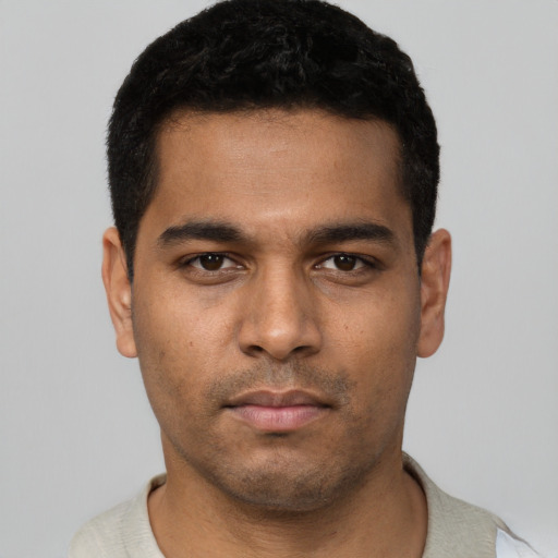 Neutral latino young-adult male with short  black hair and brown eyes