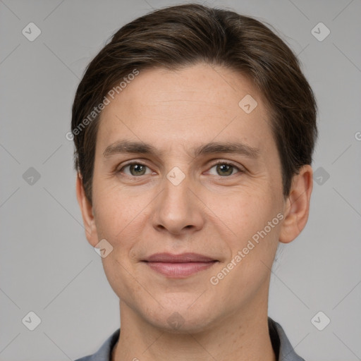 Joyful white adult male with short  brown hair and grey eyes