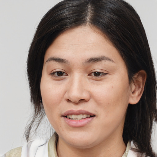 Joyful white young-adult female with medium  brown hair and brown eyes