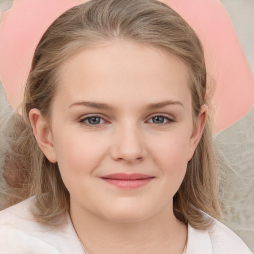 Joyful white child female with medium  brown hair and grey eyes