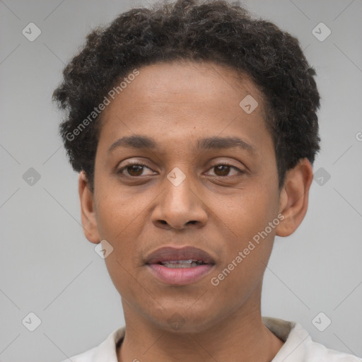 Joyful black young-adult male with short  brown hair and brown eyes