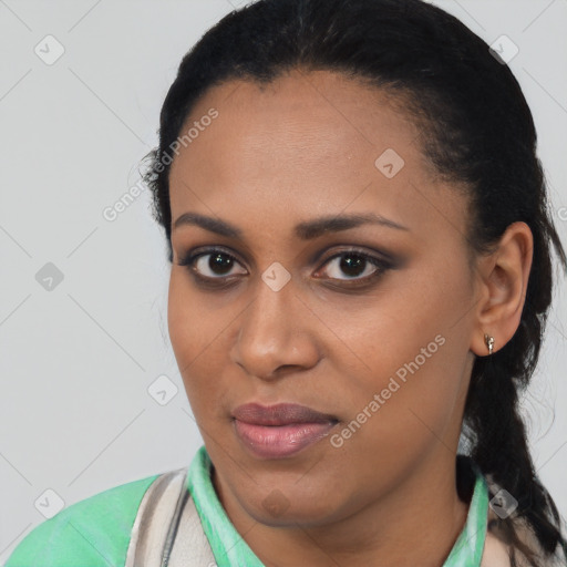 Joyful latino young-adult female with short  black hair and brown eyes