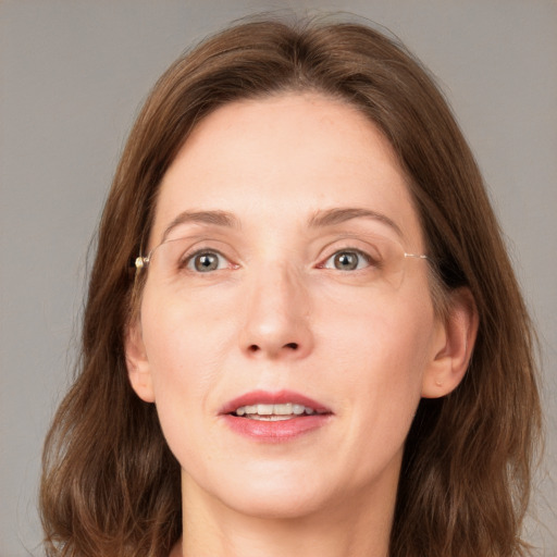 Joyful white adult female with medium  brown hair and grey eyes