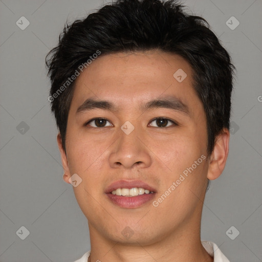 Joyful asian young-adult male with short  brown hair and brown eyes